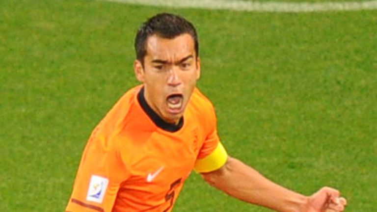 Giovanni Van Bronckhorst wheels away.