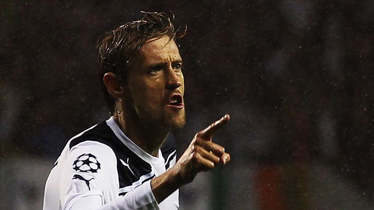 Crouch celebrates after scoring the opener for Tottenham