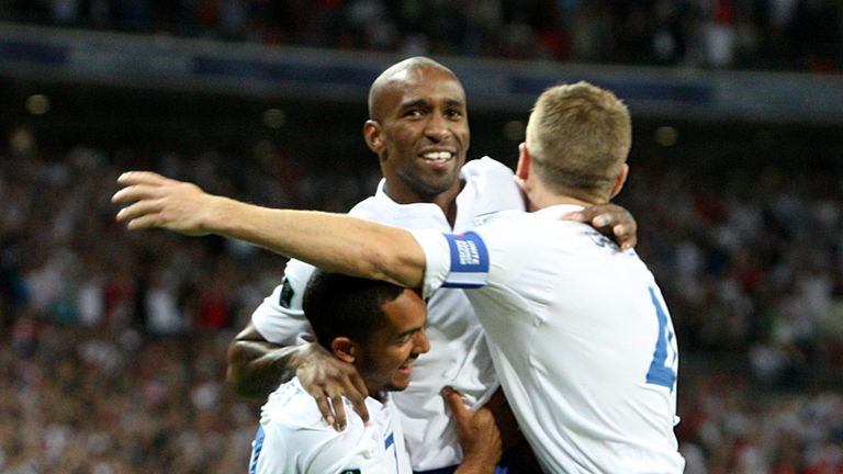 England celebrate Defoes early goal