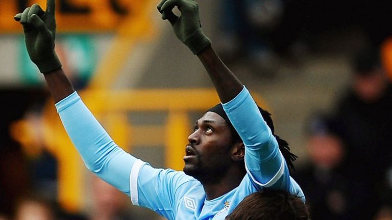 Emmanuel Adebayor tucks home from the penalty spot to put Manchester City in front at Wolves.