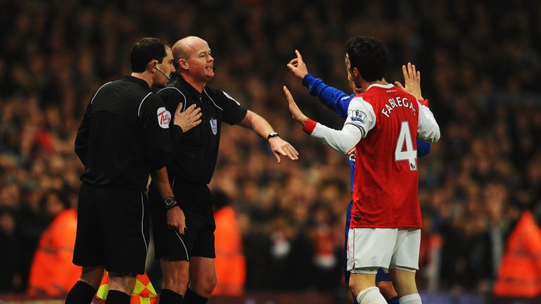 Cesc Fabregas berates referee Lee Mason after allowing Louis Sahas goal.