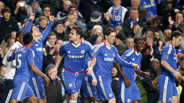 Luiz is congratulated by his team-mates after drawing Chelsea level