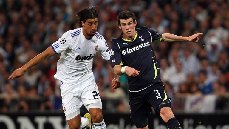 Gareth Bale tussles for the ball with Sami Khedira.