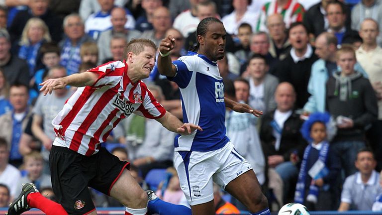 Michael Turner and Cameron Jerome tussle for the ball