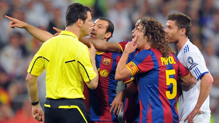 Carles Puyol appeals to the referee after an off-the-ball incident