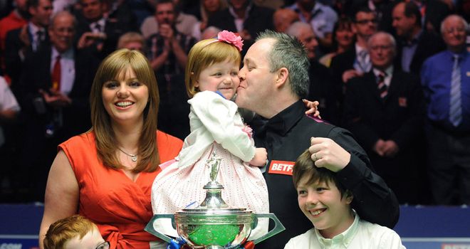 Higgins: Celebrates his world title with his family