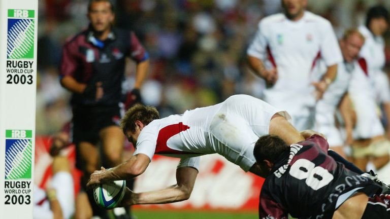 Will Greenwood dives over Georgia's George Chkhaidze to score yet another try in England's 84-6 destruction of the Lelos