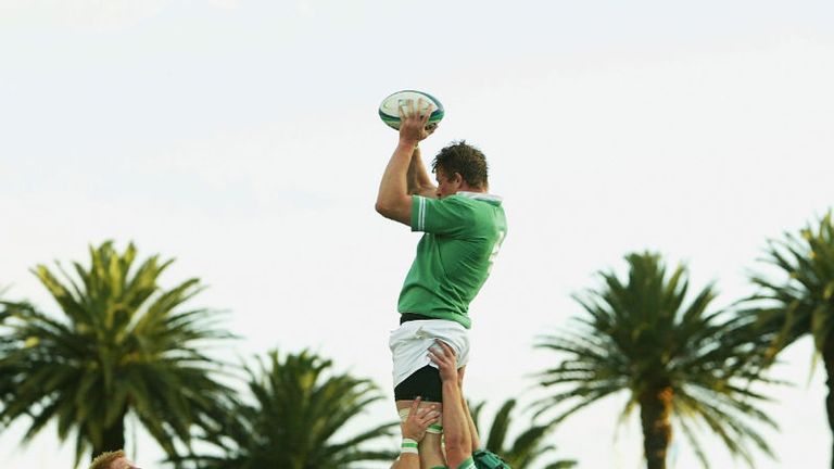 Irish lock Malcolm O'Kelly is hoisted above the palm trees against Romania in the picturesque Central Coast stadium