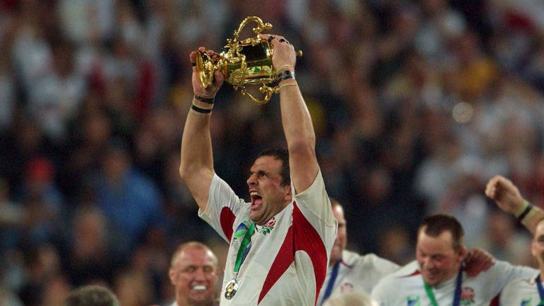 Captain Martin Johnson holds the Webb Ellis Trophy aloft as England win their first World Cup