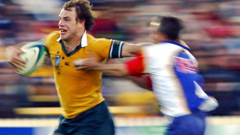 David Croft races away from the Namibian defence as the Wallabies pick up one of the sport's biggest ever victories, crushing the African team 142-0