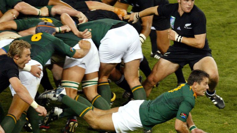 Scrum-half Joost van der Westhuizen attempts to clear the ball from the scrum, as the Springboks were sent packing by New Zealand in the quarter-finals