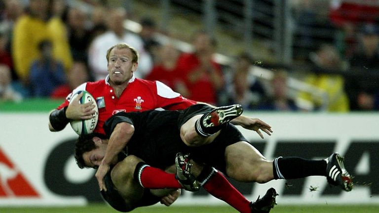 Gareth Edwards is knocked off his feet in a 53-37 defeat to New Zealand. However both teams progressed to the quarter-finals