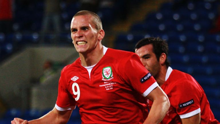 Steve Morison celebrates scoring Wales opener against Montenegro 