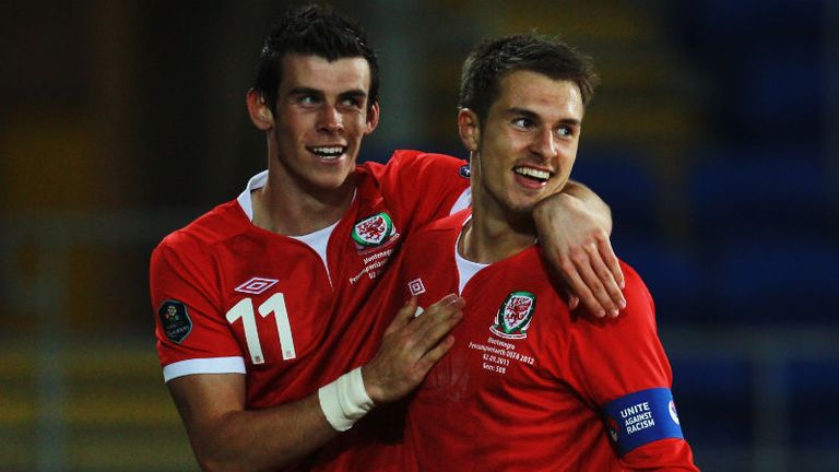 Aaron Ramsey celebrates with team mate Gareth Bale after scoring his sides second goal 