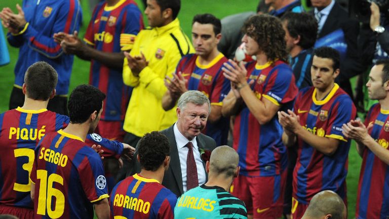 Ferguson is flanked by Barcelona players, after his team were taught a footballing lesson by the Catalans in the 2011 Champions League final.