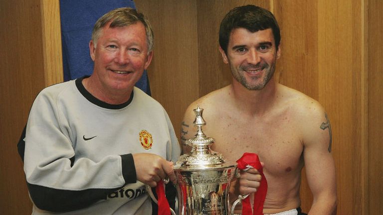 Ferguson's longest-serving captain, Roy Keane, lifts the 2004 FA Cup with his gaffer, but United were beaten to the league by the Arsenal Invincibles.