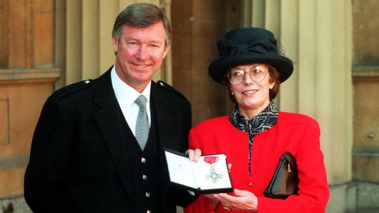 Fergie becomes Sir Fergie as he receives his MBE and new title from the Queen in 1995.