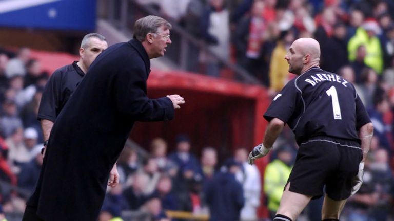 Fergie has a word in the year of his erratic French goalkeeper, Fabien Barthez, during United's clash with Liverpool in 2001.