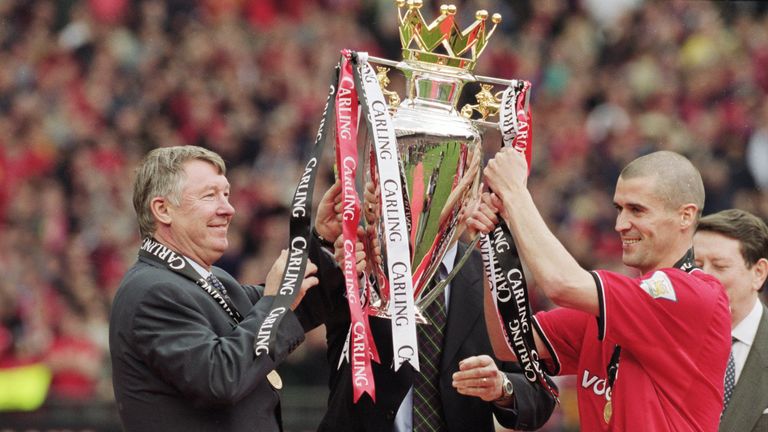 Ferguson joins club captain Roy Keane in lifting the Premier League at the end of the 2000/01 season, as United won their third title in a row.