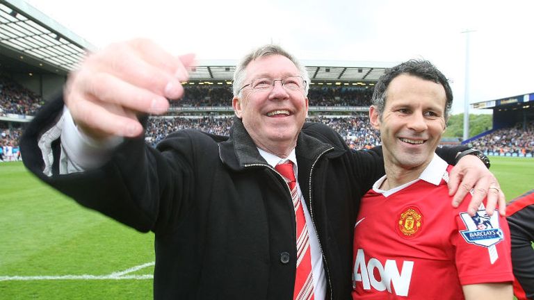 Ferguson embraces his longest serving player, Ryan Giggs, as United are confirmed as 2010-11 Premier League champions at Ewood Park.