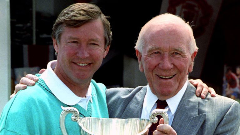 Two United legends, Ferguson and Sir Matt Busby hold aloft the European Cup Winners' Cup.