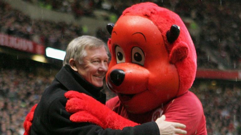 Fergie embraces Fred the Red following a Premier League match at Old Trafford in 2006.