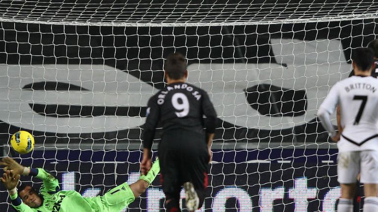 Michel Vorm saves a penalty from Clint Dempsey as Swansea beat Fulham