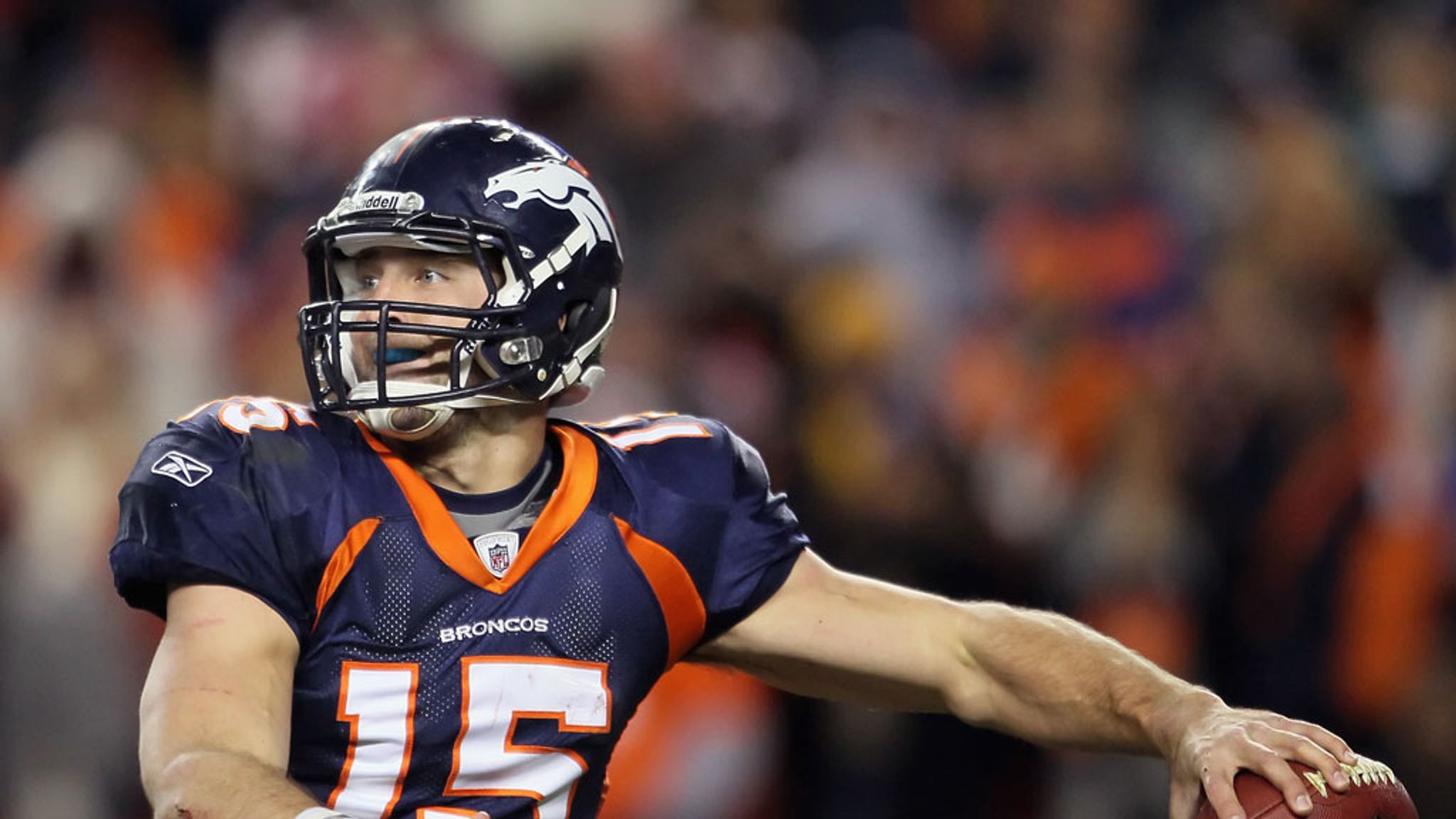 Denver Broncos quarterback Tim Tebow (15) throws a pass in the