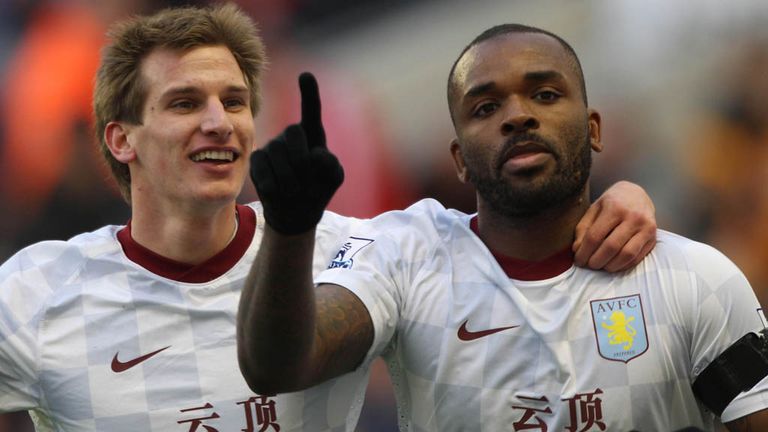 Darren Bent (R) and Marc Albrighton (L) celebrate the opening goal of the game at Molineux