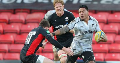 Manu Tuilagi (R): The powerful centre sets off on a barnstorming run against Saracens