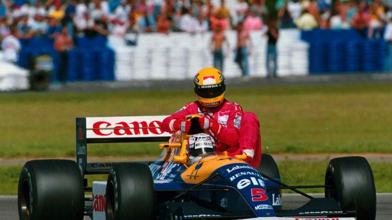 Here after running out of fuel on the final lap at Silverstone, Mansell gives Senna a lift back.