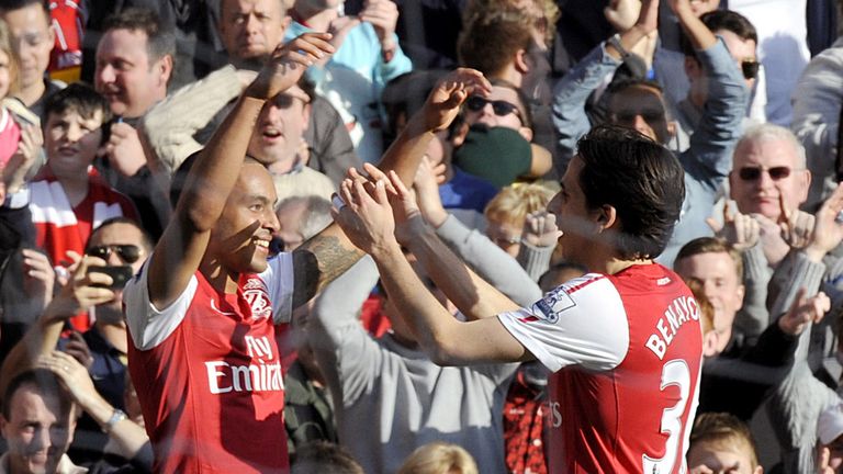Theo Walcott celebrates after scoring twice in Arsenal's amazing 5-2 win