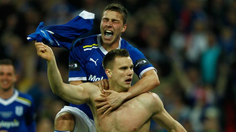 Ben Turner celebrates with Filip Kiss as he notches Cardiffs late extra time equaliser