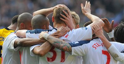 Bolton players huddle after David Wheater scores the opening goal at the Reebok, on a day on which the club shows its love for Fabrice Muamba.