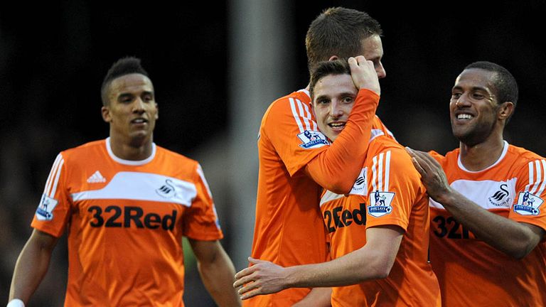 Joe Allen celebrates adding Swansea's third with 13 minutes remaining