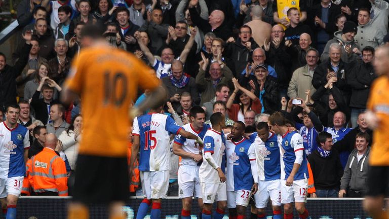 Goalscorer: Junior Hoilett is congratulated by his Blackburn team-mates for his strikes which led to a 2-0 win at Wolves