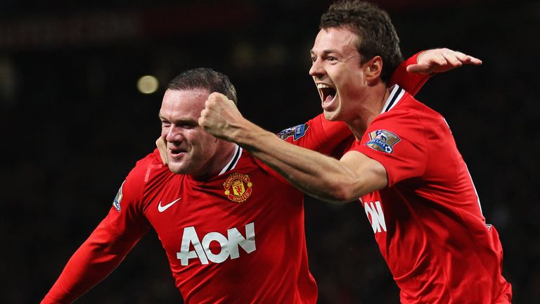 Jonny Evans celebrates with Wayne Rooney the only goal against Fulham
