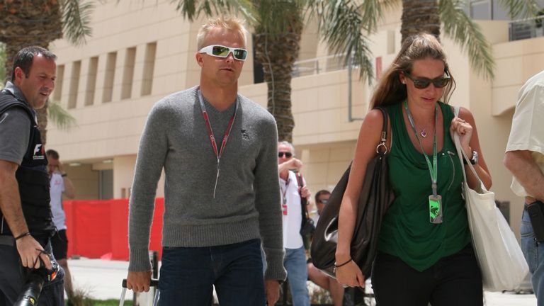 Heikki Kovalainen arrives at the track with his girlfriend