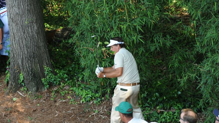 Playing out of a bush right handed on way to a triple bogey