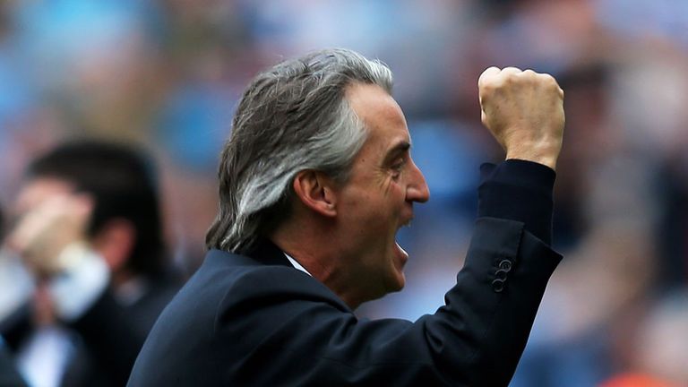 Roberto Mancini celebrates City's dramatic winner against QPR
