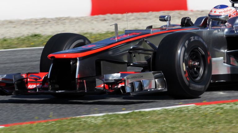 Jenson Button tries out the new nose on the McLaren...