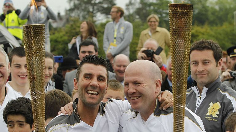Olympic silver medal winner Wayne McCullough left and Olympic gold medal winning boxer Michael Carruth right at the ceremony to hand over the Olympic Torch at the border crossing between the Republic of Ireland and Northern Ireland 