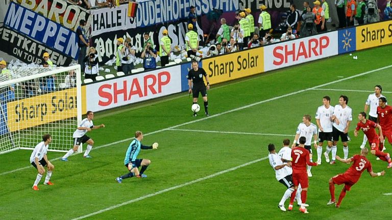 Pepe controls the ball from a corner and strikes towards goal, but the ball clips the underside of the bar and bounces off the line and out.