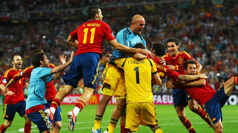 Cesc Fabregas: Mobbed by his team-mates after scoring the winner