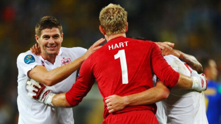 Steven Gerrard and Joe Hart celebrate with team mates after progressing into the quarter-finals 