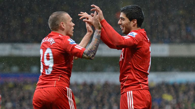 Uruguayan striker celebrates scoring for Liverpool at Carrow Road in April 2012