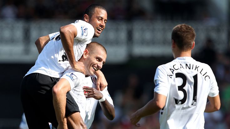 Mladen Petric of Fulham celebrates his second goal with team mate Moussa Dembele L and Alex Kacaniklic R during the Barclays Premier League match between Fulham and Norwich City at Craven Cottage on August 18, 2012 in London, England.