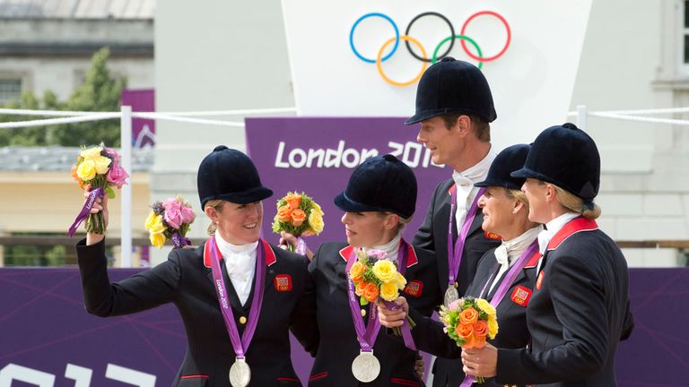 Silver medalists Britains LtoR Nicola Wilson, Zara Phillips, William Fox-Pitt, Mary King, and Kristina Cook pose on the podium after the team Eventing competition of the 2012 London Olympics at the Equestrian venue in Greenwich Park, London, July 31, 2012.