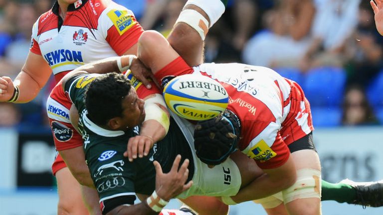 Ofisa Treviranus of London Irish is upended by Gloucesters Tom Savage as the Cherry and Whites win