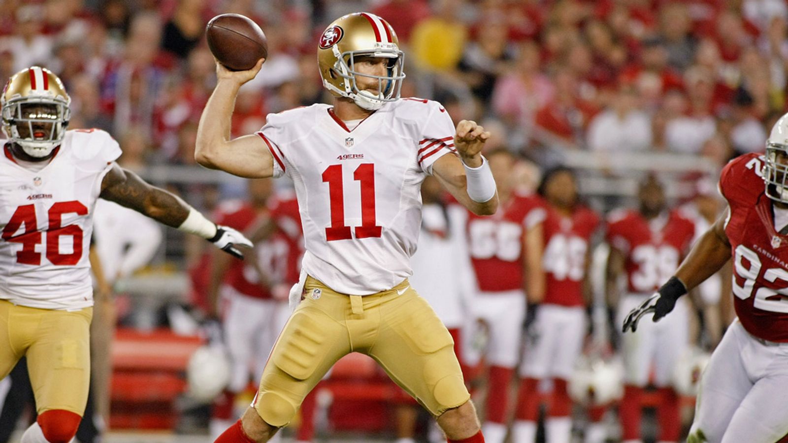 Quarterback Alex Smith of the San Francisco 49ers prepares to throw a